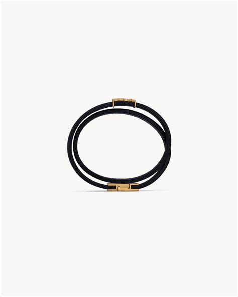 ysl double wrap bracelet in black leather and gold-toned brass|CASSANDRE double wrap bracelet in leather and metal .